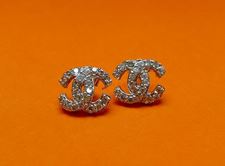 Picture of “C” stud earrings in sterling silver with round cubic zirconia, two interlocking C-shapes - medium