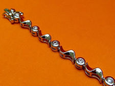 Picture of “Waves of Zirconia” tennis bracelet in sterling silver, round cubic zirconia interspersed with silver waves 