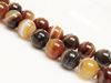 Picture of 10x10 mm, round, gemstone beads, natural striped agate, caramel to deep brown