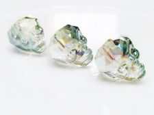 Afbeeldingen van 14x10 mm, glaskralen, schedel in facetten, kristal, doorschijnend, groene iris