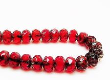 Picture of 7x10 mm, carved cruller beads, Czech, deep ruby red, transparent, picasso