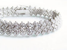 Picture of “Zirconia in rhombus setting” bracelet in sterling silver, a wave of  round cubic zirconia in rhombus pattern